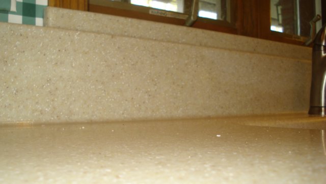 covedbacksplashsolidsurfacecountertopbyquarrystonedsc01030.jpg